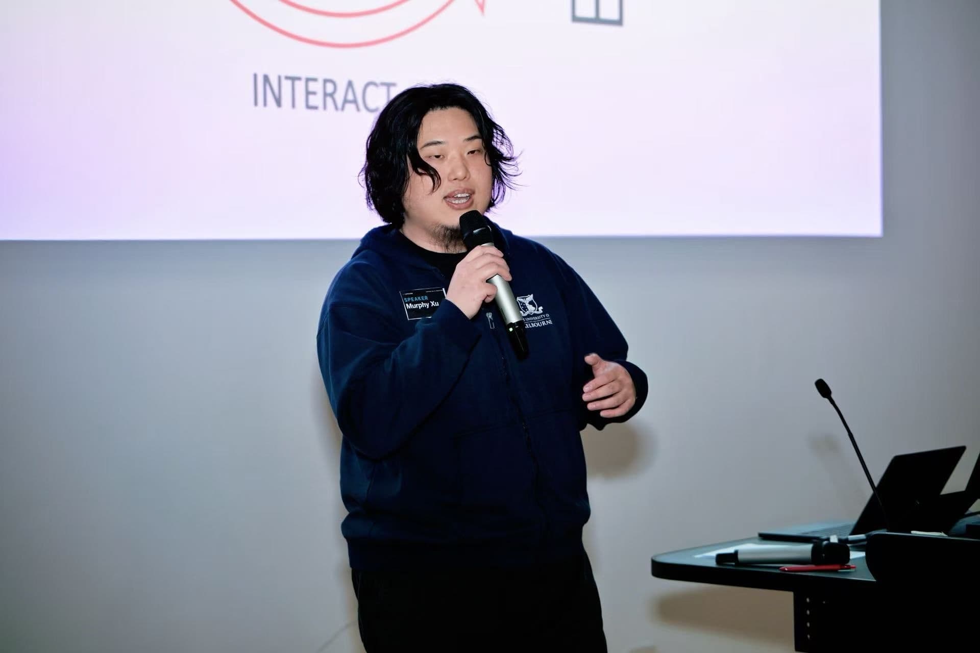 Ausdroid researcher Yangmengfei (Murphy) Xu speaking at the Capricorn 26 Productathon Opening Day