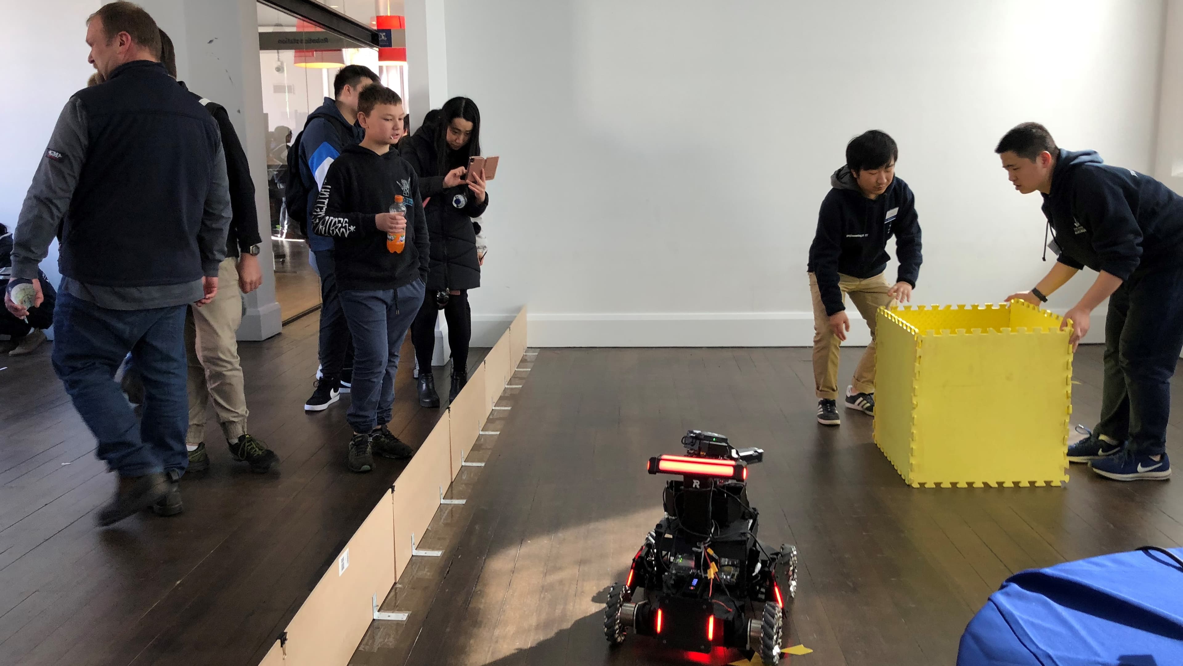 Visitors and volunteers around Ausdroid’s robot display at Open Day 2018