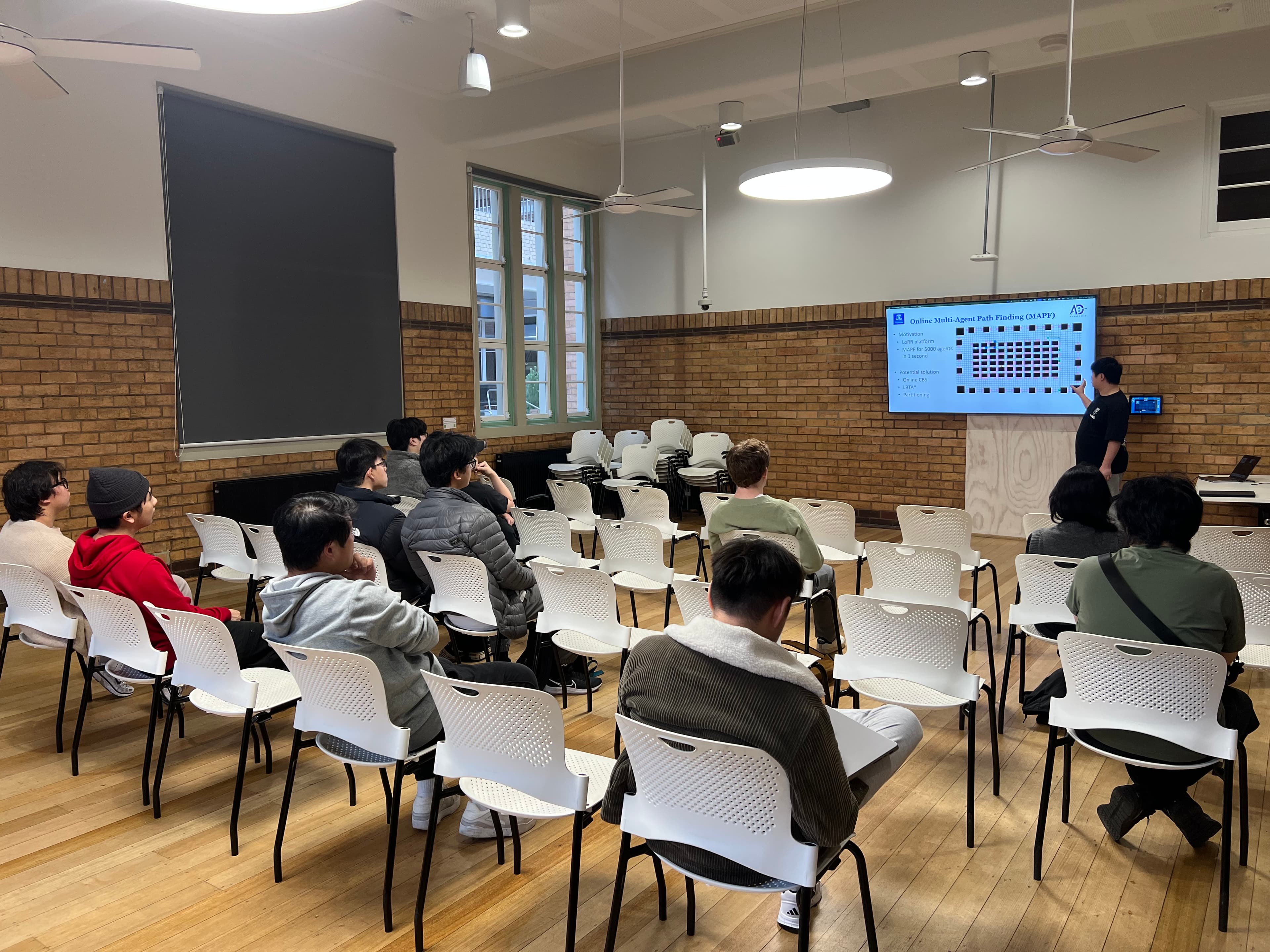 Students attending a research project introduction on multi-agent path finding