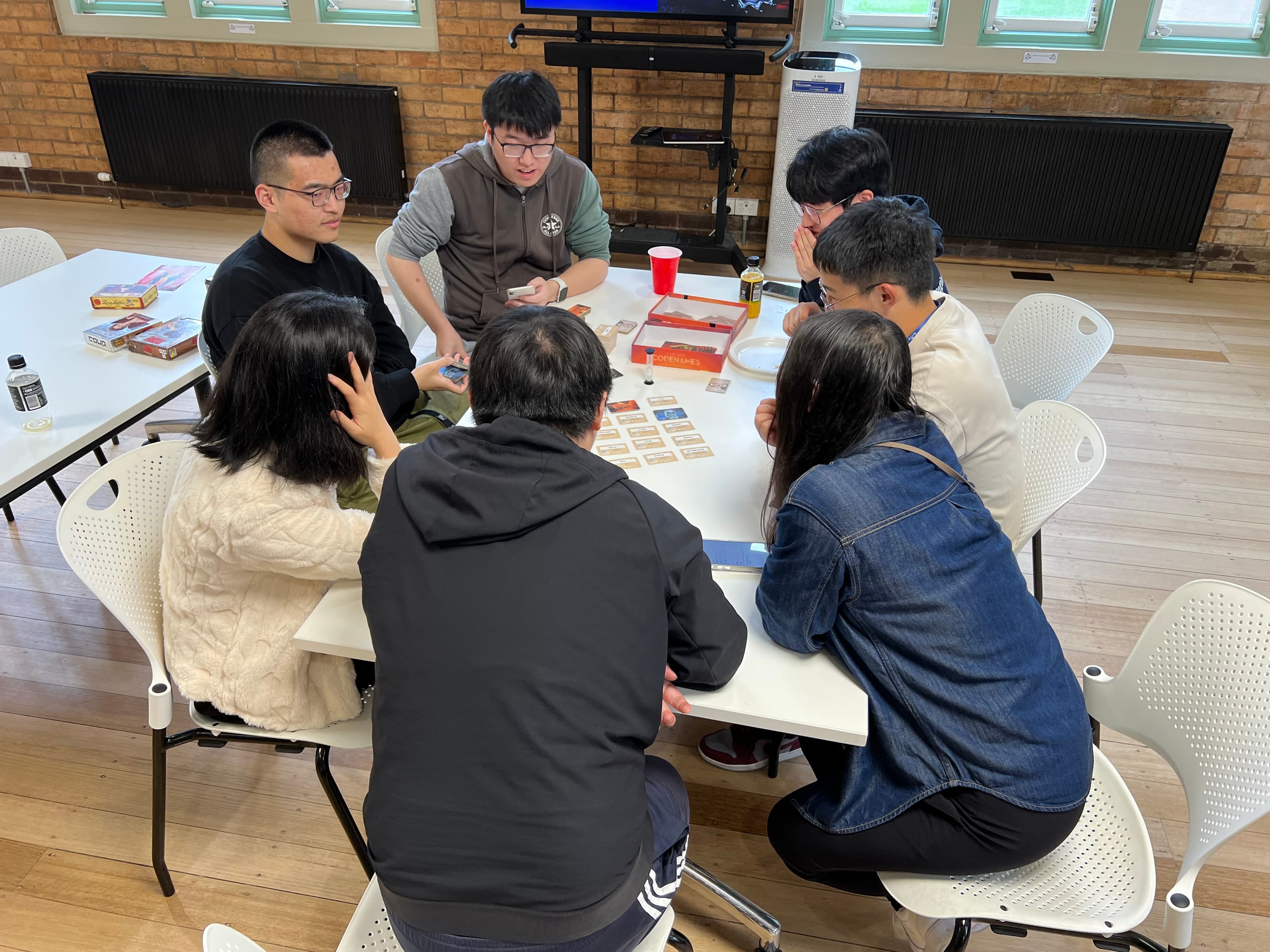 Ausdroid members playing board games at a December 2023 gathering